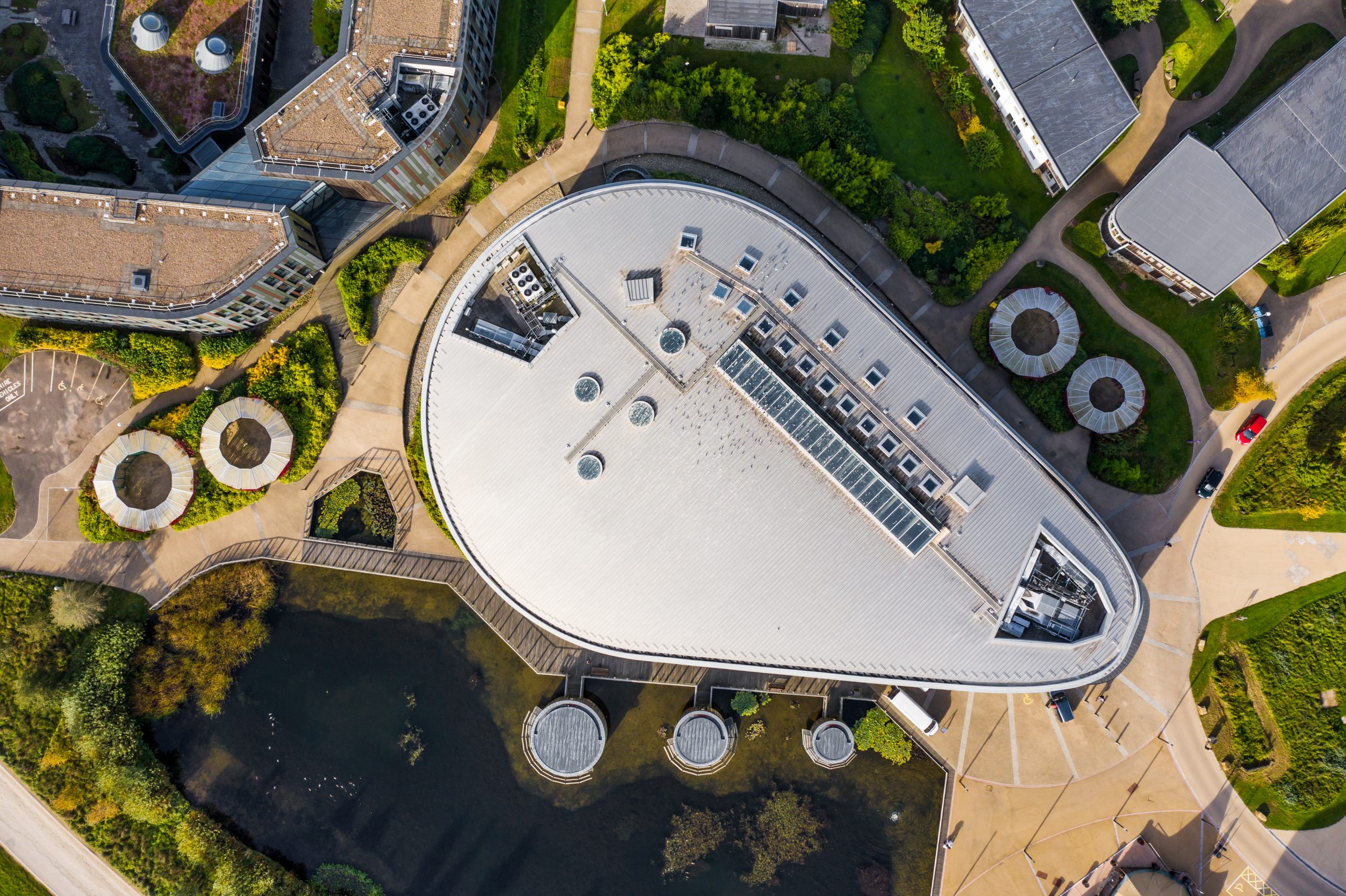 aerial view of a futuristic building designed by a 2023 11 27 05 13 29 utc